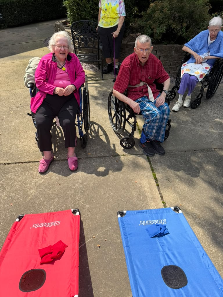 Residents enjoying cornhole at Prairie Gardens