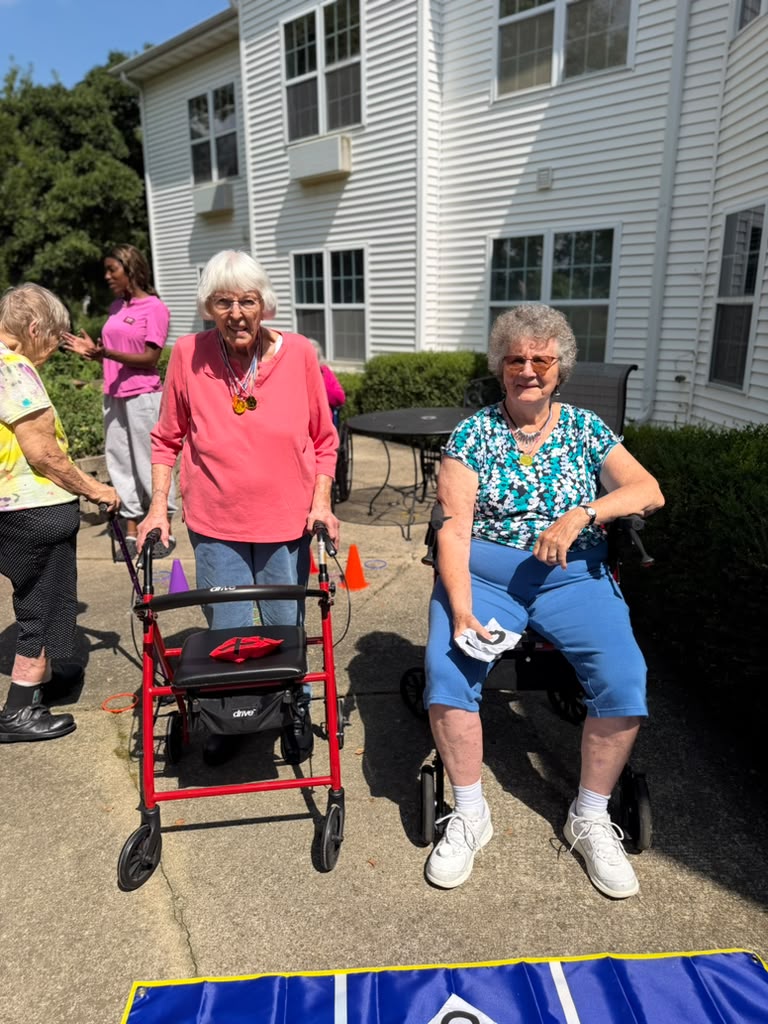 Residents celebrating with medals at Prairie Gardens